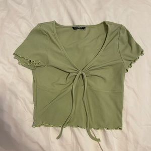 Shein; Green top with small opening in the middle. Size medium.